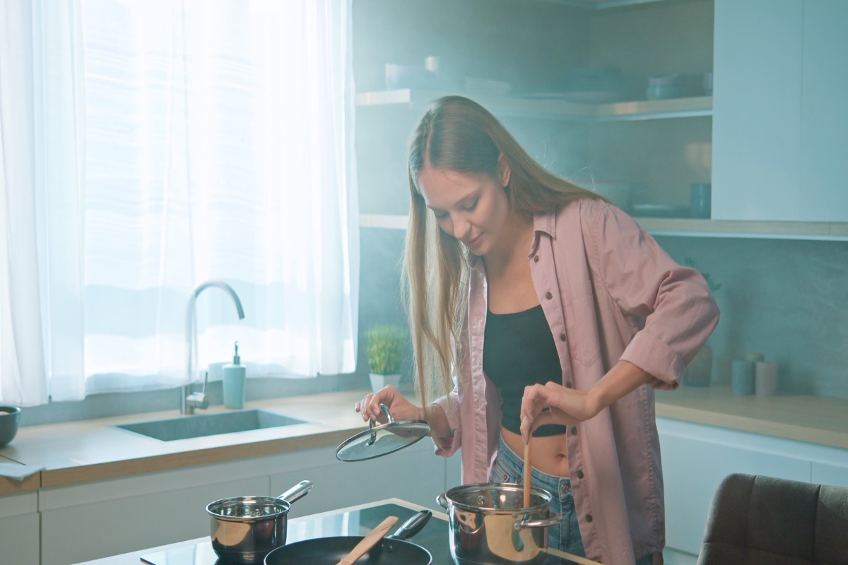 Culinary workshop with people cooking and preparing food together in a kitchen